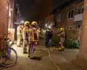 Brand in portiekwoning