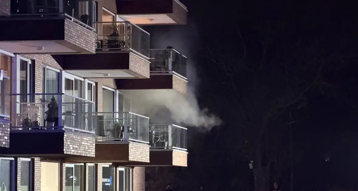 Woningbrand leidt tot evacuatie en gewonden - Foto 4