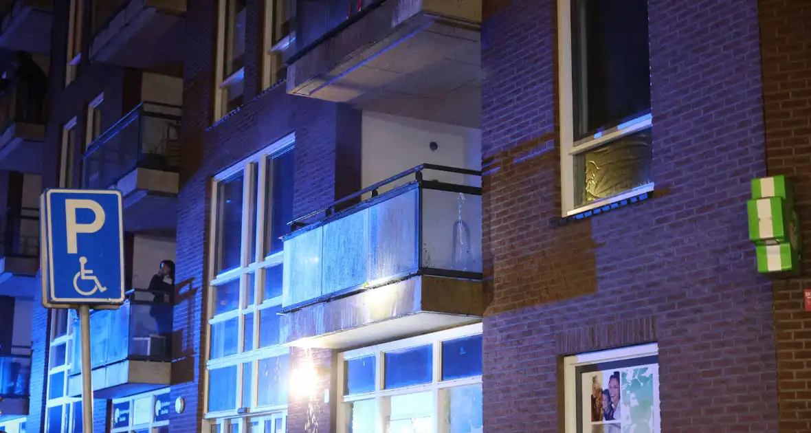 Bouwbrand op balkon geëindigd zonder opzet - Foto 3