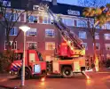 Brand in portiekwoning geblust