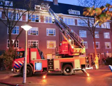 Brand in portiekwoning geblust