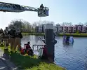 Brandweer redt bezorger uit het water