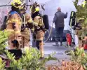 Vuilcontainer in brand in loods