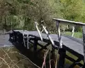 Houten brug verwoest door brand