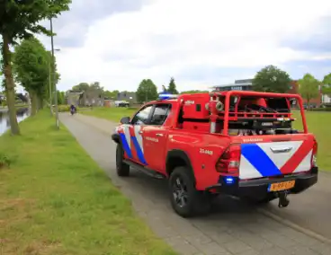 Auto in brand door gesprongen leiding