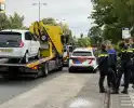 Automobilist botst achterop politieauto