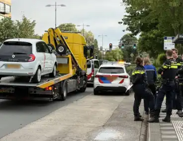 Automobilist botst achterop politieauto