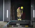 Voertuig in brand in bedrijfspand