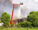 Grote rookontwikkeling en mogelijke explosie bij brand