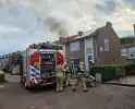 Flinke rookontwikkeling bij containerbrand achter woning