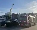 Brandweer koelt dak nadat airconditioning uitvalt