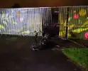 Scooter in brand bij een school