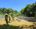 Omstanders doven brand voor aankomst brandweer