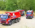 Buitenbrand in bosgebied vereist inzet van brandweer