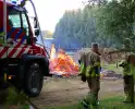 Vlammen slaan hoog op bij brand in afvalberg