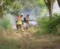 Medewerkers starten blussing rietbrand
