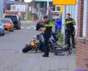 Motorrijder en fietser in botsing bij kruising