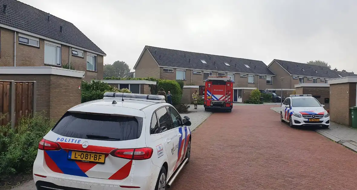 Voordeur woning geforceerd bij waterlekkage - Foto 3