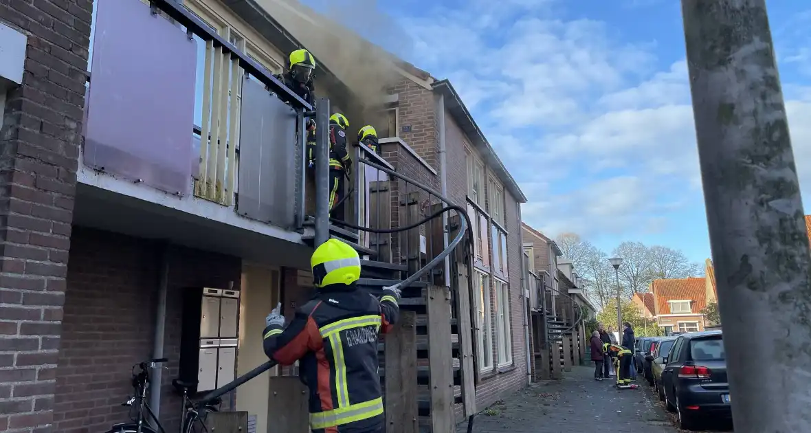 Deur open gezaagd bij brand - Foto 6