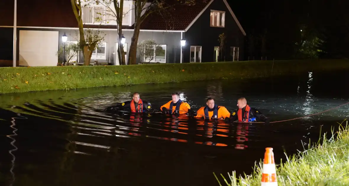 Zoekactie na aangetroffen scooter in het water - Foto 5