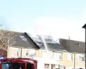 Uitslaande brand in dak van woning
