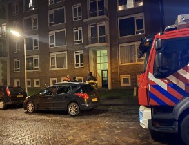 Deur ingeslagen vanwege brand