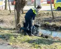 Scootmobiel raakt te water op industrieterrein